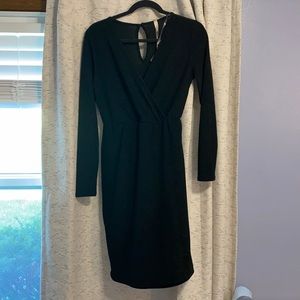 black wrap slit dress with subtle sparkle. Maternity friendly.